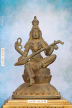 9.5″ Saraswathi with Veena on Lotus Base | Handcrafted Brass | Green Stone Finish — size and dimensions